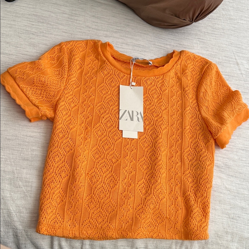 Zara Orange blouse
New with Tag